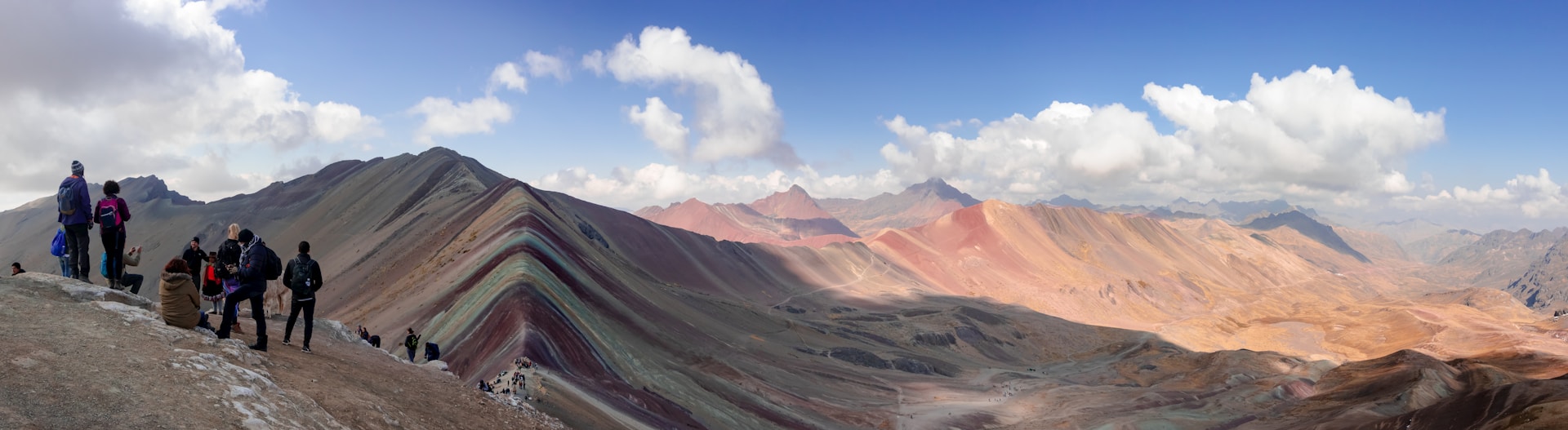 Rainbow Mountain Vinicunca aerial view of full colour striation pattern, mineral bands across hillside, Peru destination overview