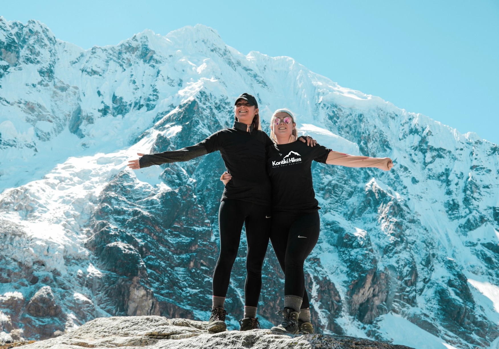 Trekkers at the Salkantay Pass at 4,630m on the Classic Salkantay Trek to Machu Picchu from Cusco, Peru