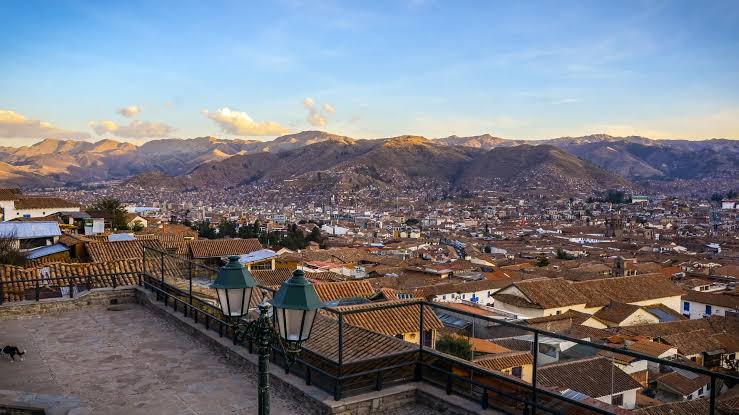 San Blas neighbourhood cobbled street in Cusco — whitewashed colonial walls and artisan workshops, Day 7 of 8-day Wonders of Peru itinerary