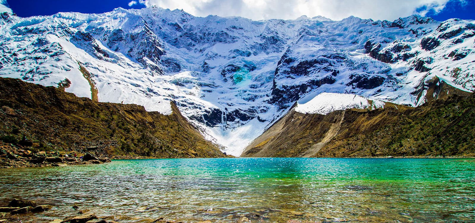 Humantay Lake turquoise glacial water with Humantay mountain reflected on the surface, Salkantay range, Cusco Peru, Day 6 of 8-day Wonders of Peru itinerary
